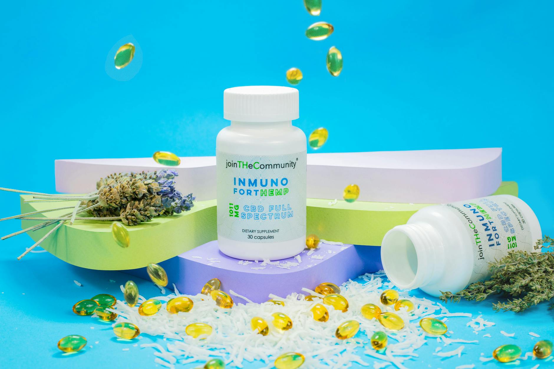 CBD capsules, lavender, and hemp on a vibrant blue background. — Atrium Scientific Group