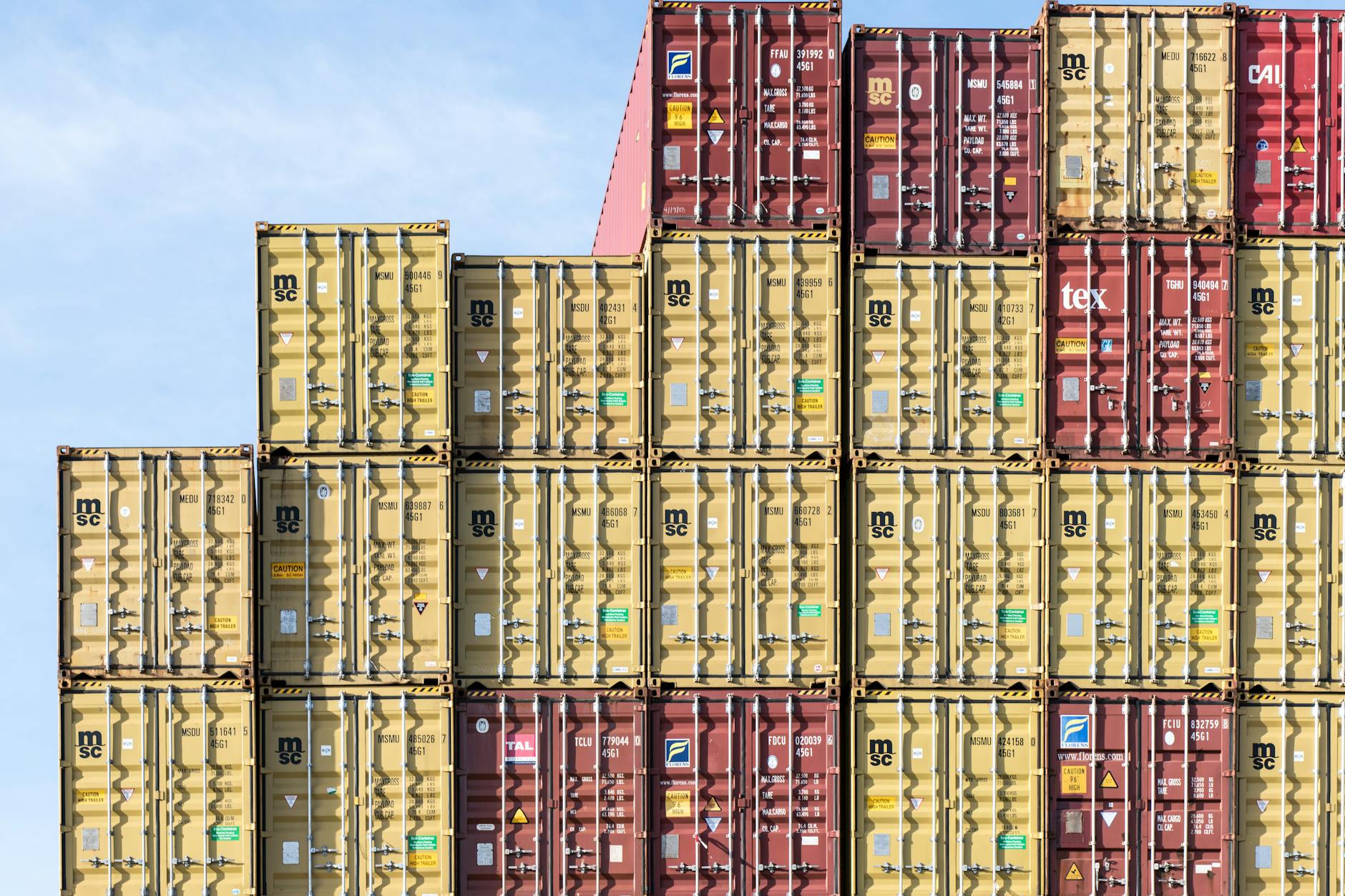Colorful stacked shipping containers at Hamburg port, showcasing global trade and logistics. — Atrium Scientific Group