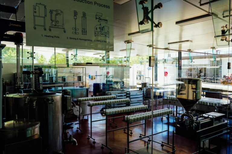 Spacious and modern food production plant interior with industrial machinery and processing line. — Atrium Scientific Group