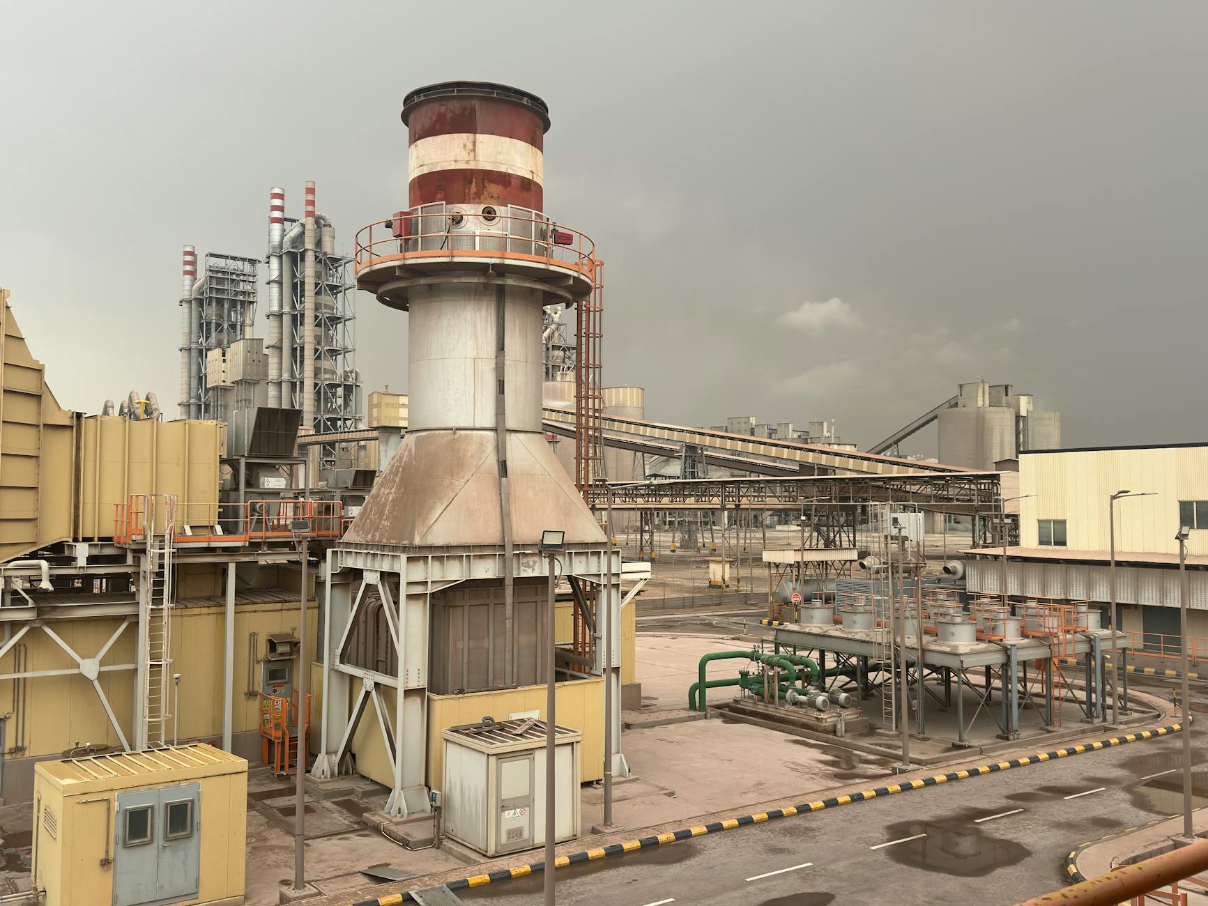A large industrial facility on a cloudy day in Saudi Arabia, showcasing structures and machinery. — Atrium Scientific Group