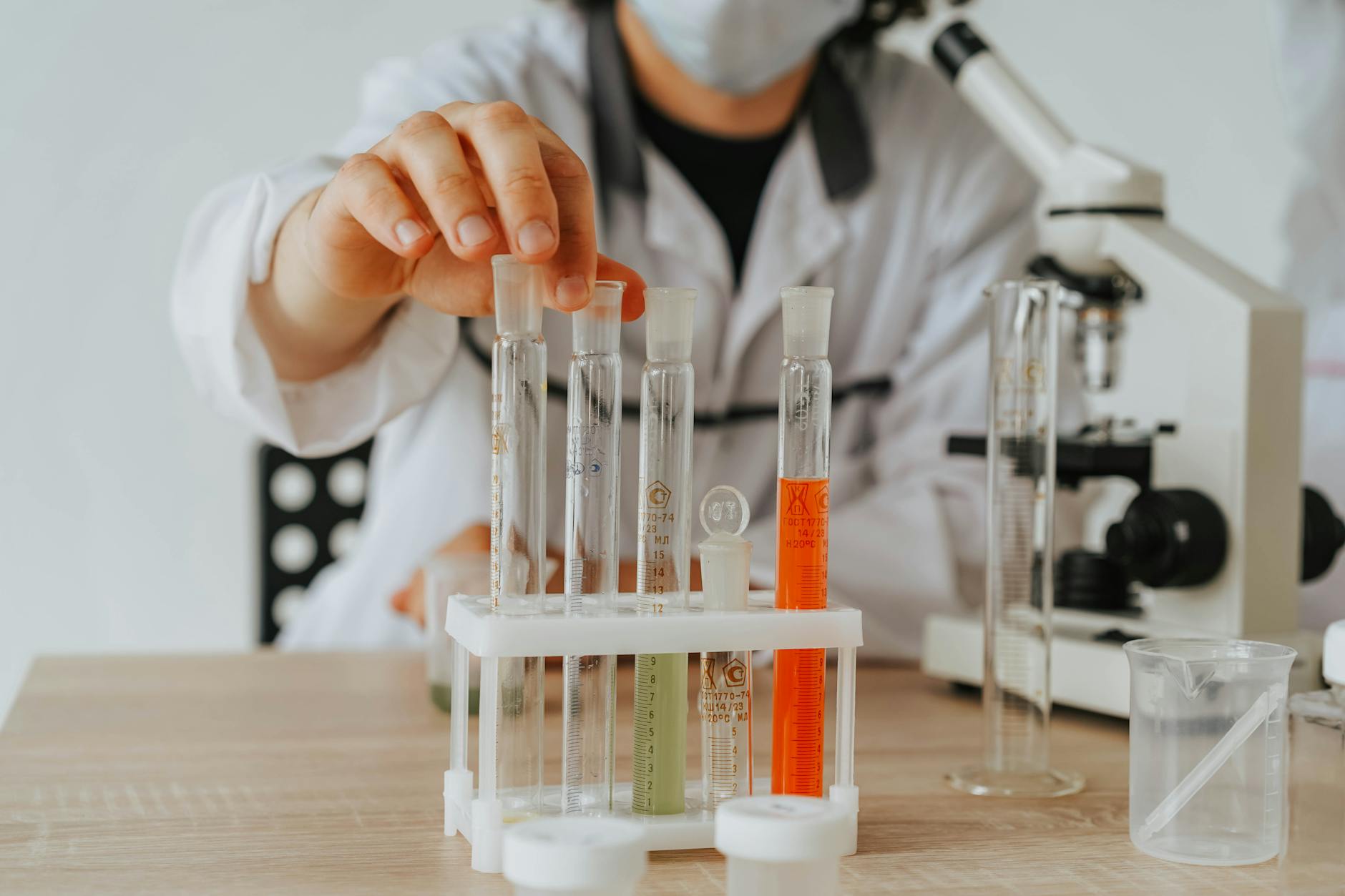Custom supplement formulation — R&D laboratory with scientist developing new nutraceutical product formulas